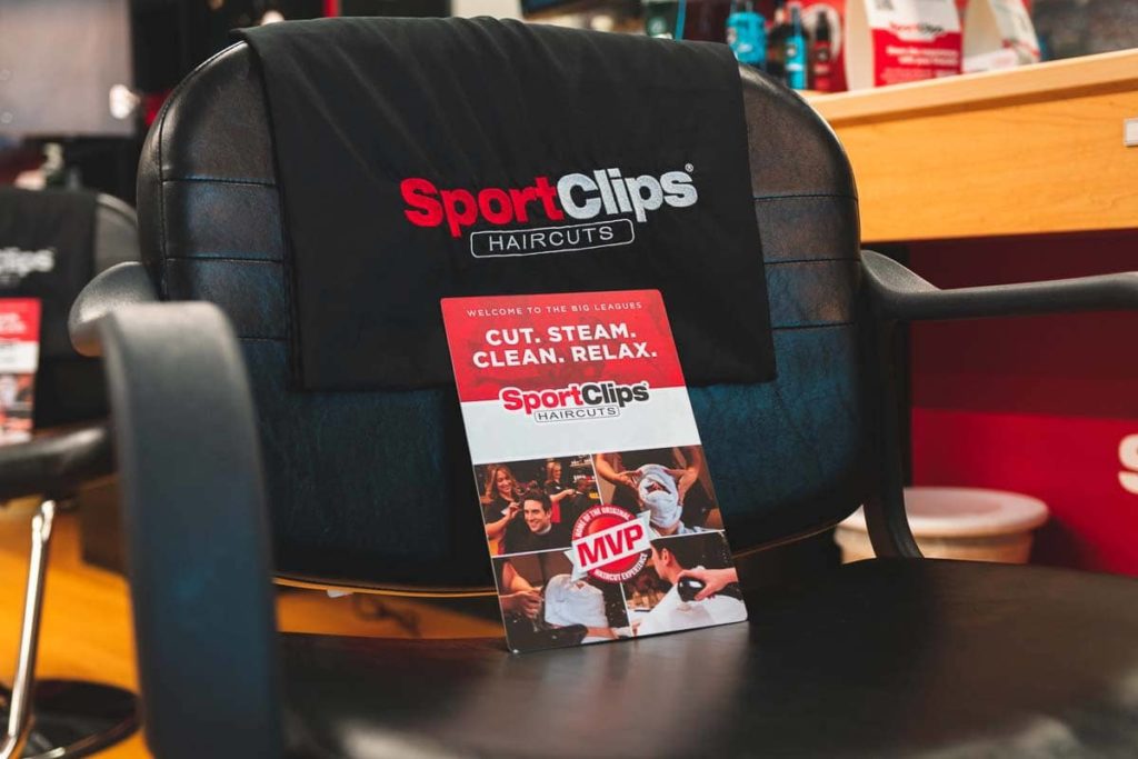 Sport Clips pamphlet on a Sport Clips Barber Chair  